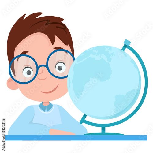 Cute boy student in glasses smiling and looking at the globe