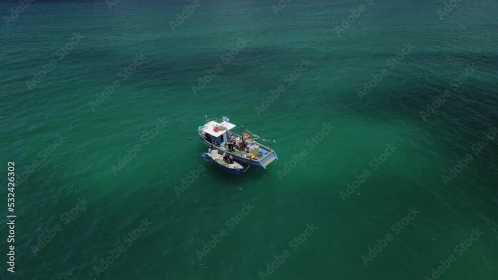 Drone tracking fishing boats in the turquoise colored Haifa bay at Hof Hacarmel in Israel Drone tracking fishing boats in the turquoise colored Haifa bay at Hof Hacarmel in Israel