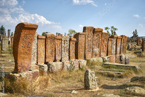 Row of old khachkars at Noratus cemetery in Armenia photo