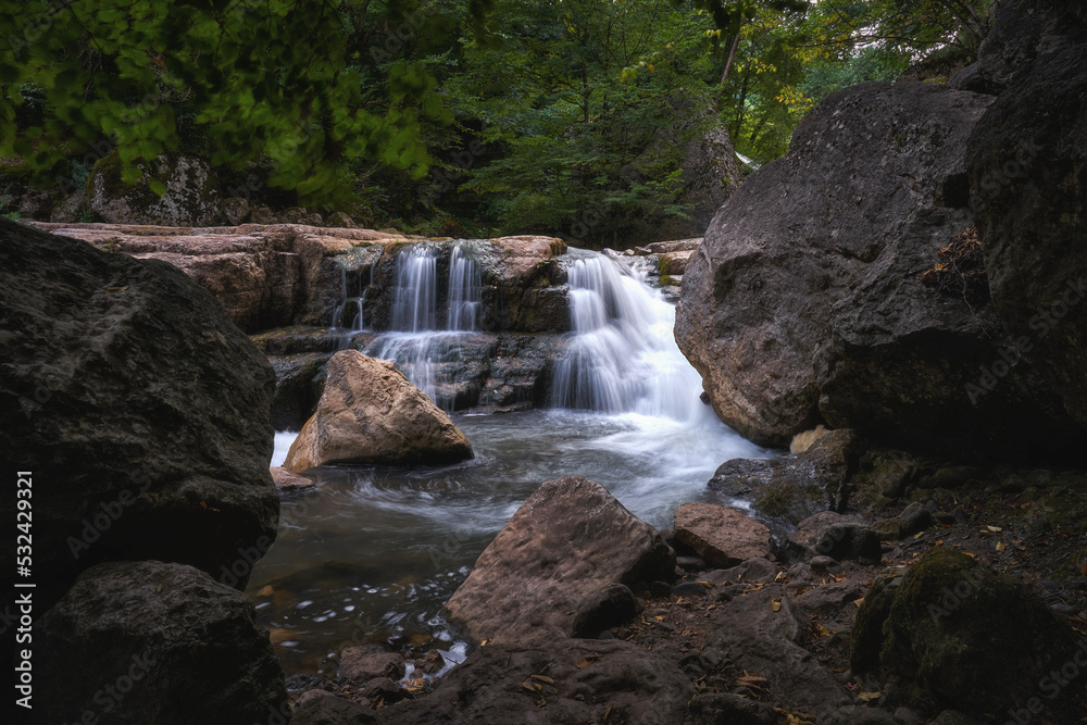 Small waterfall at Sarnajur river in the woods