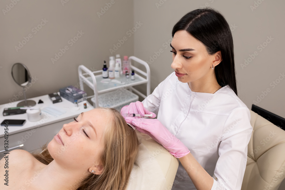 woman in salon doing mesotherapy of hair woman in salon doing mesotherapy of hair