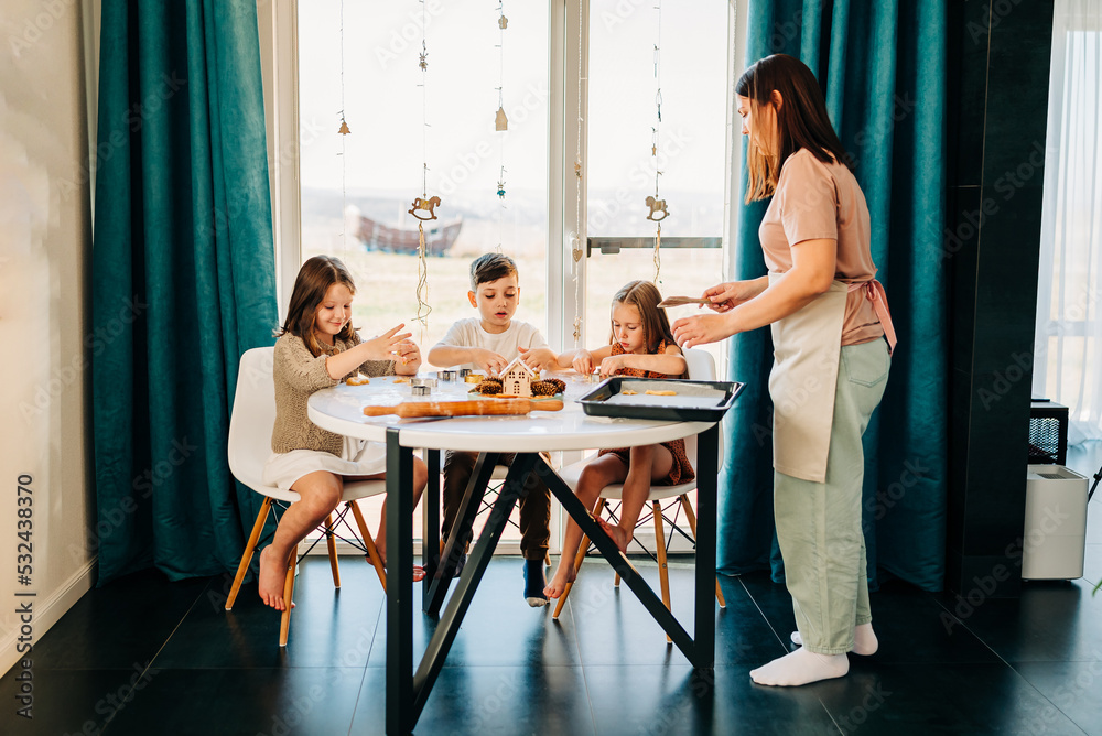 Big family with two moms cooking with their children cookies. Loving people and happy childhood hobbies Big family with two moms cooking with their children cookies. Loving people and happy childhood hobbies