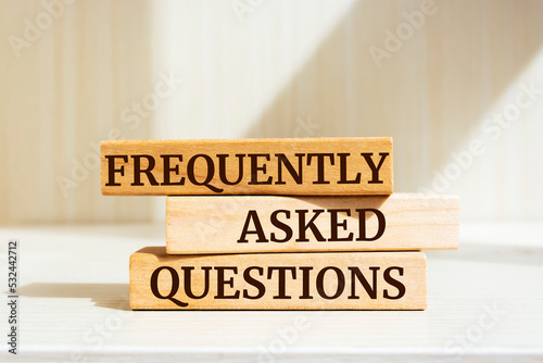 Wooden blocks with words 'Frequently Asked Questions'. Business concept