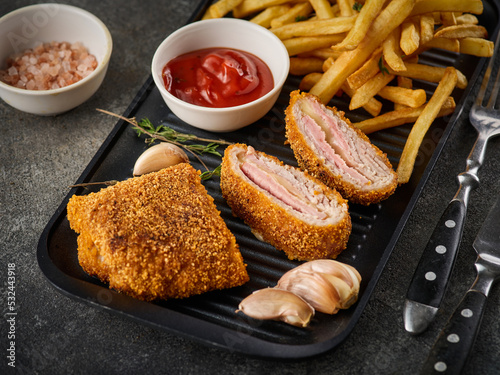 Canvas-taulu Fried chicken Cordon bleu with cheese and ham in breadcrumbs with french fries