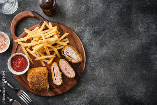Cordon bleu and french fries. Chicken cordon bleu schnitzel, meat wrapped around ham and cheese, breaded and fried