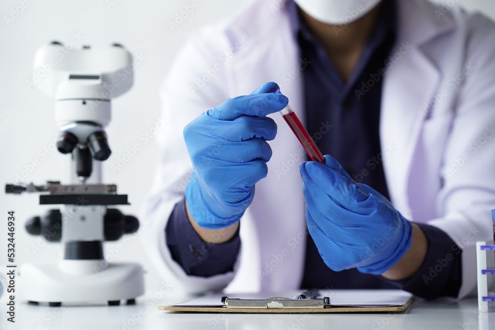 Lab worker preparing test blood for detection of antibodies and infections Corona virus.
