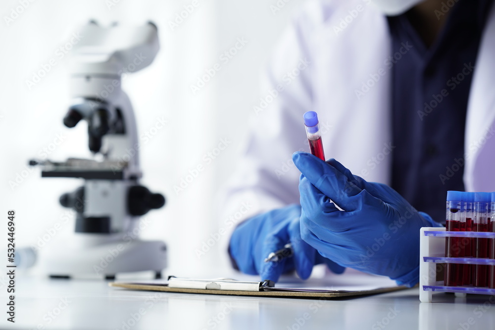 Lab worker preparing test blood for detection of antibodies and infections Corona virus.
Lab worker preparing test blood for detection of antibodies and infections Corona virus.