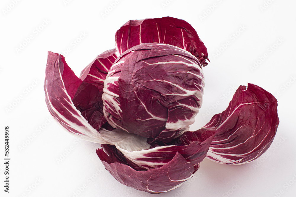 Obraz premium Fresh red radicchio salad isolated on white background