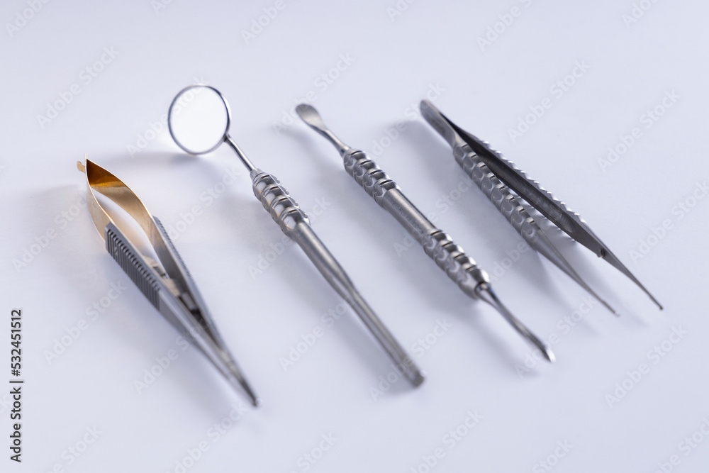 Dental instruments used by a dentist in daily practice on a white background Dental instruments used by a dentist in daily practice on a white background