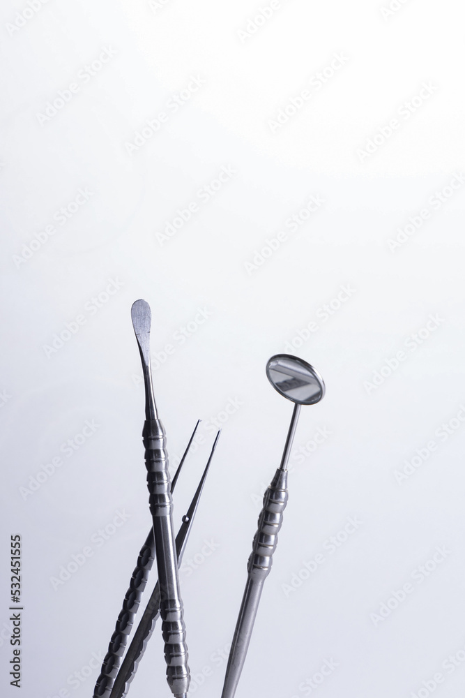Dental instruments used by a dentist in daily practice on a white background Dental instruments used by a dentist in daily practice on a white background