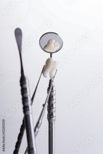 Dental instruments used by a dentist in daily practice on a white background © victor198226