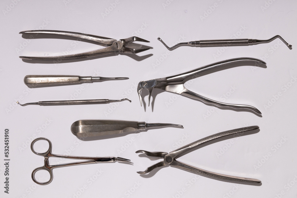 Dental instruments used by a dentist in daily practice on a white background Dental instruments used by a dentist in daily practice on a white background