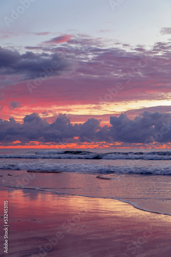 Cloudy pinks on a rainy morning, on the beach at Gold Coast.