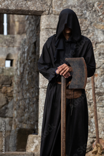 Middle Ages Executioner with a rusty iron Axe, Santa Maria da Feira, Portugal.