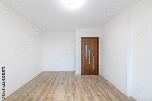 Empty bright living room. New home. Beautiful apartment interior. Wooden floor