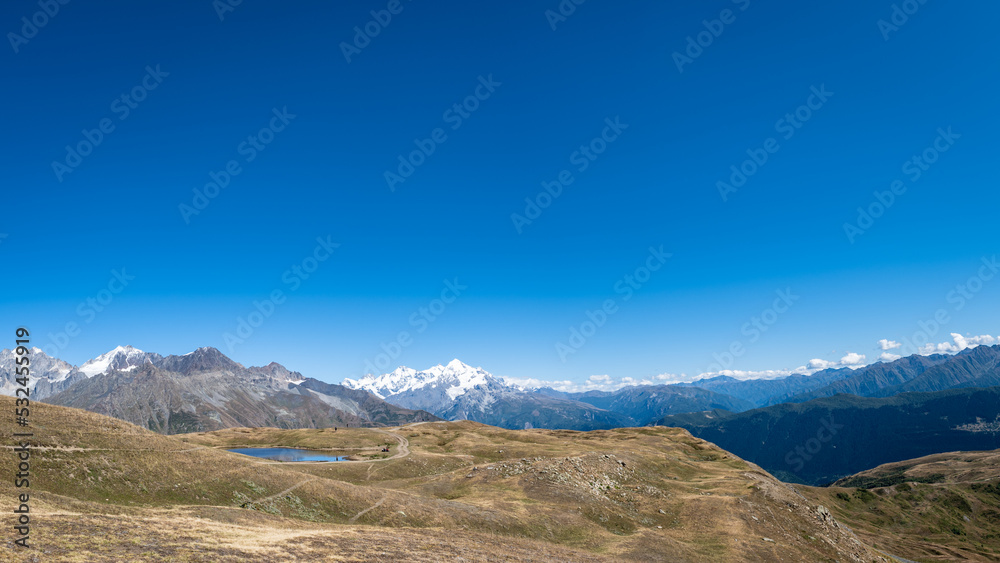 Mountain hiking panorama landscape in Mestia, Svaneti region in Georgia. Landscape of summer mountain around Koruldi lakes area with snow in Caucasus