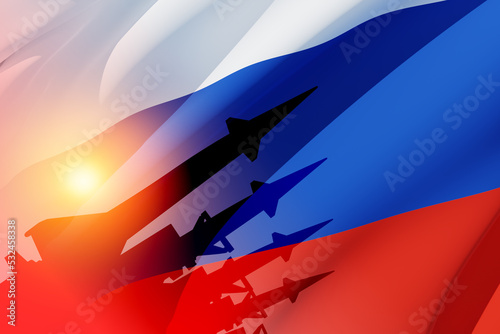 Fotografiet Silhouette of missiles on a background of the flag of Russia and the sun