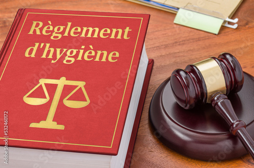 Law book with a gavel - Hygiene Regulations in french - Règlement d'hygiène photo