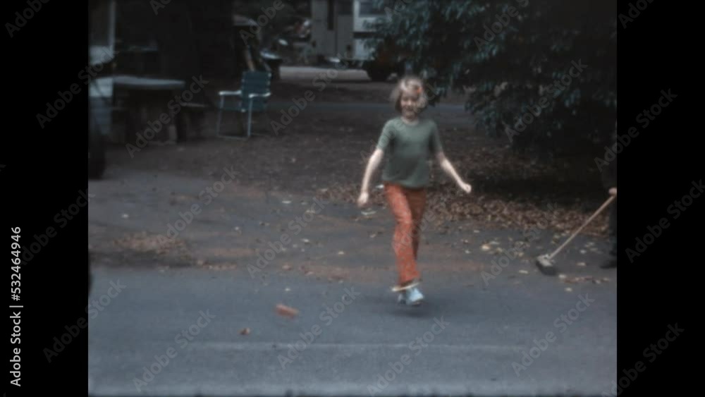 Skipping and Sweeping 1968 - A girl skips while her brother sweeps the driveway at El Capitan State Beach campground, in California, 1968. Skipping and Sweeping 1968 - A girl skips while her brother sweeps the driveway at El Capitan State Beach campground, in California, 1968.
