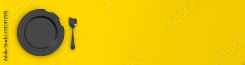 Konstfotografi bitten black plate on a yellow background