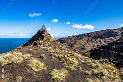The finger of god, rock formation on the coast of Agaete, Roque Guayedra, Gran Canaria, Spain photo