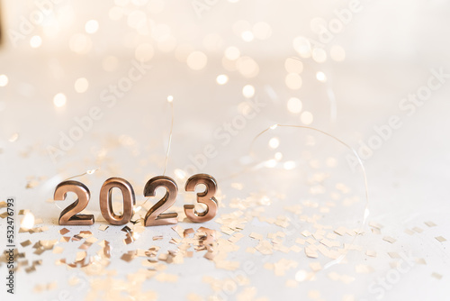 happy new year 2022 background new year holidays card with bright lights,gifts and bottle of hampagne photo