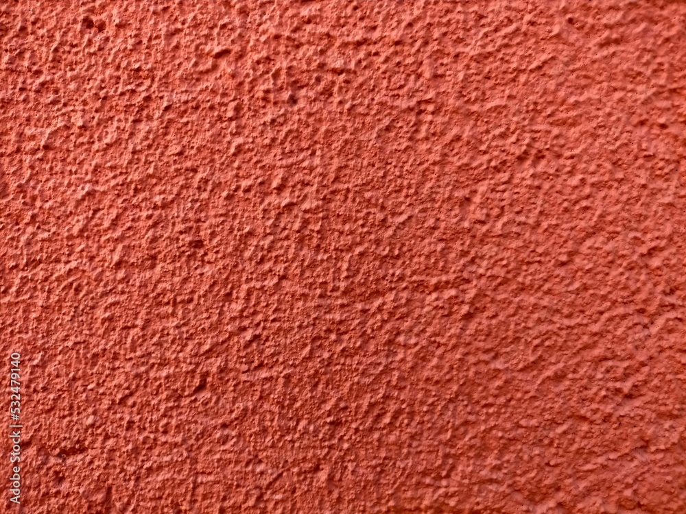 Fototapeta premium The red cement wall ,has a rough surface. For texture background images