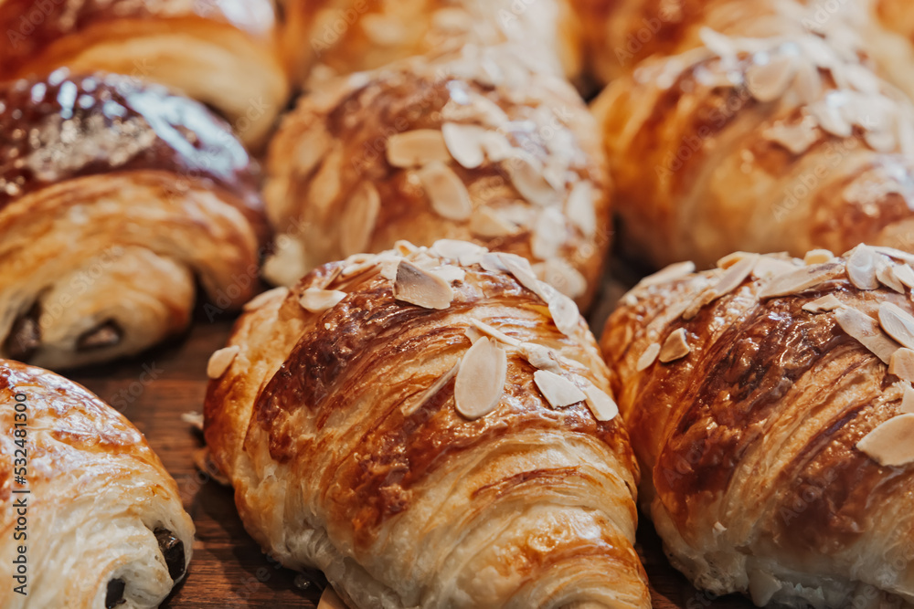 Fresh almond and chocolate croissants at a bakery