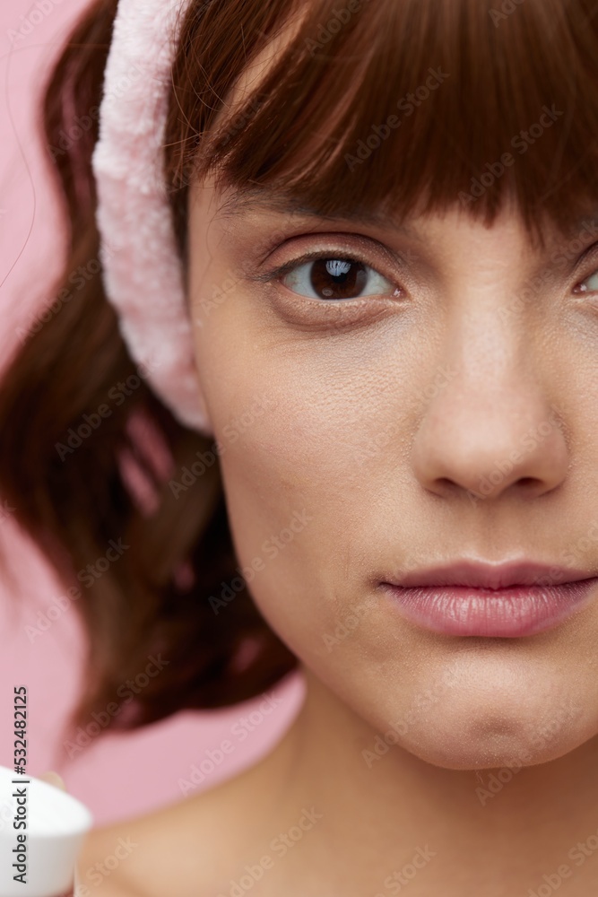 close vertical photo of a young woman with clean, well-groomed skin looking into the camera close vertical photo of a young woman with clean, well-groomed skin looking into the camera