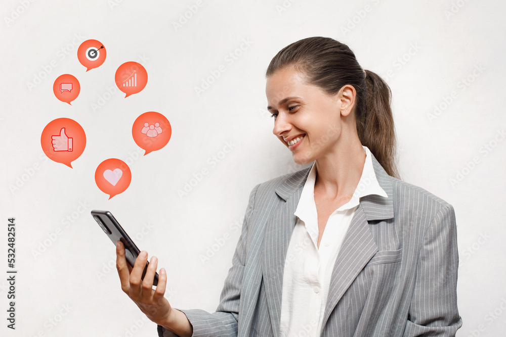 Happy caucasian female in jacket using smartphone, analyzing social media promotion strategies, marketing, white background Happy caucasian female in jacket using smartphone, analyzing social media promotion strategies, marketing, white background