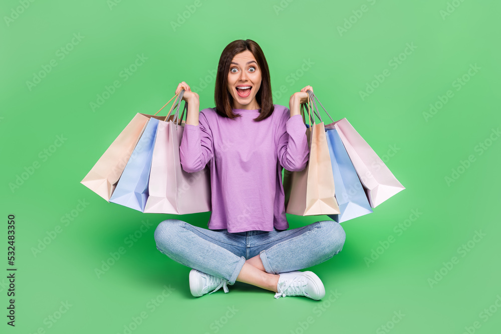 Full size photo of young pretty gorgeous nice woman crazy emotion open mouth speechless deal shopping unexpected sales isolated on green color background