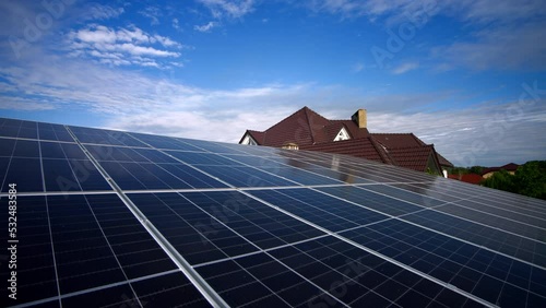 Solar panels on a green energy farm. Power generators produce electricity using solar panels with sunlight. Installing solar panels can provide the cottage with free electricity. Solar panels at home.