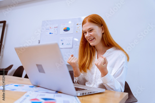beautiful business woman working in company office with cheerfulness