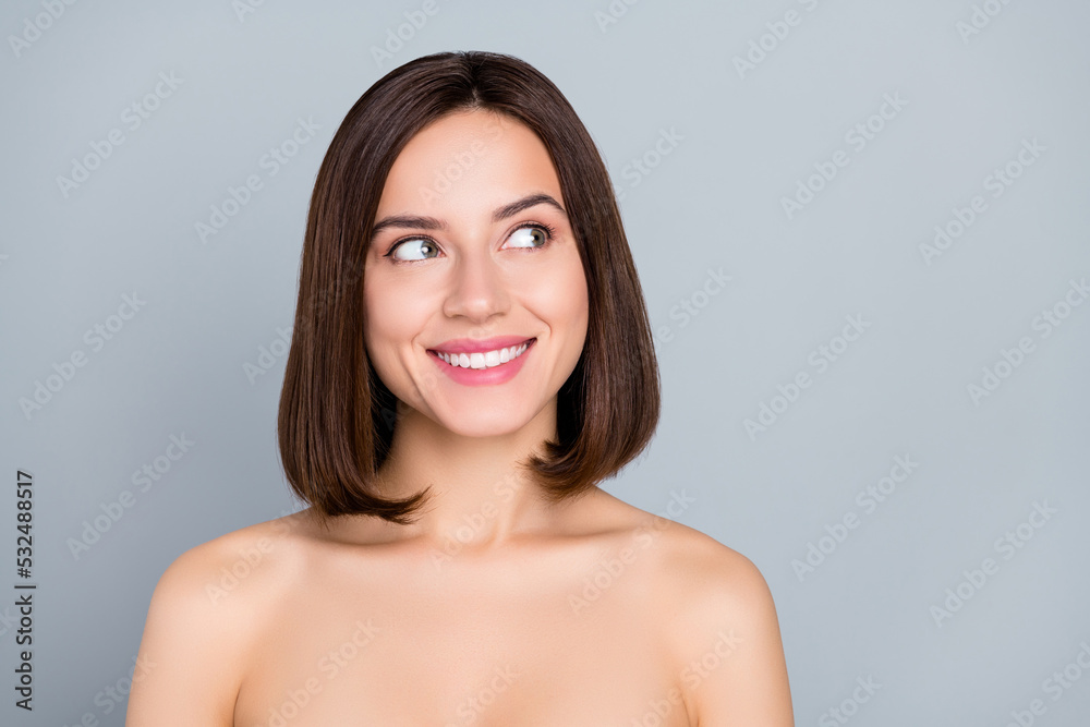 Photo of joyful lady look empty space advertisement peeling lifting treatment isolated over grey color background Photo of joyful lady look empty space advertisement peeling lifting treatment isolated over grey color background