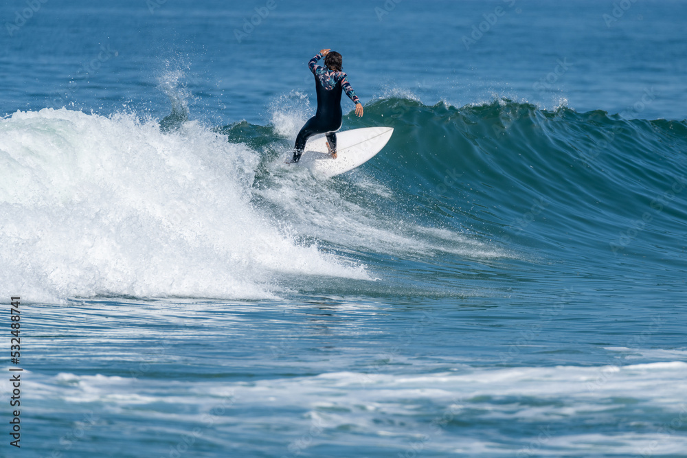 Surfer girl riding a wave