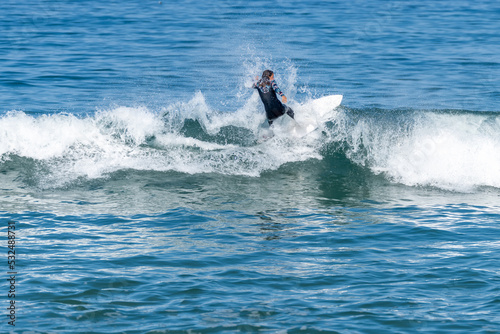 Surfer girl riding a wave