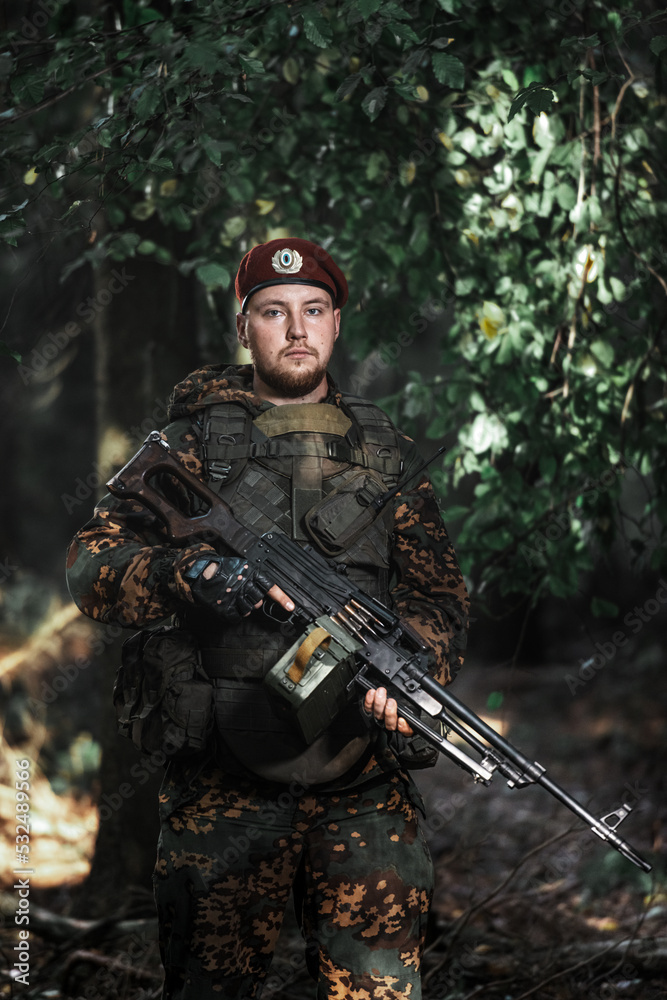 Obraz premium Portrait of an eastern special forces soldier with rifle
