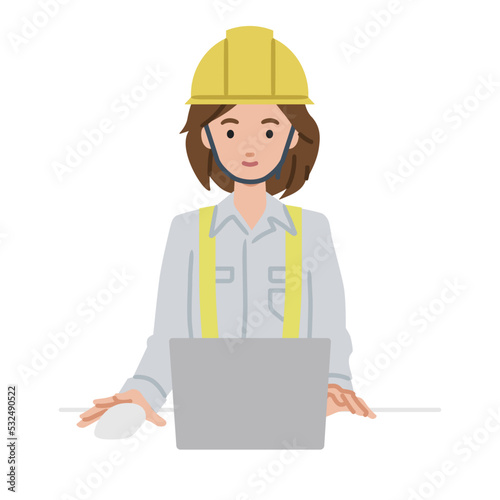 デスクで座ってPCを使っている工事現場の女性