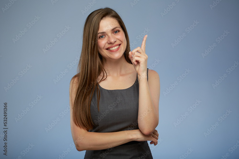 Smiling business woman pointing up with finger at copy space. isolated portrait.