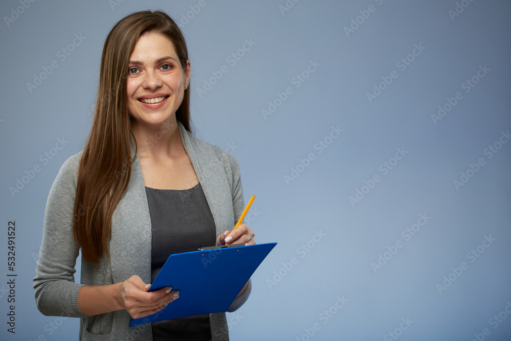 Smiling woman accountant standing with clipboard for your tax report. Isolated portrait. Smiling woman accountant standing with clipboard for your tax report. Isolated portrait.