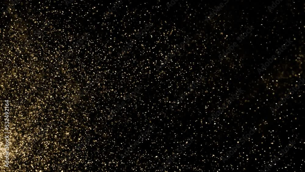 Gold dust particles fly in slow motion in the air lingering slowly. Dust Particles Background Bokeh Lights Background on Black Background 4k Footage Snow Particles Background.