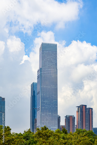 High-rise building with glass curtain wall in city business district © Steve