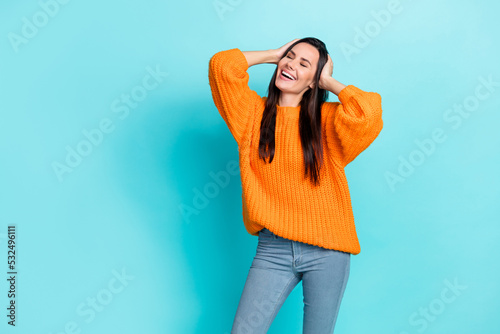 Portrait of lovely satisfied girl closed eyes hands touch hair head empty space isolated on teal color background
