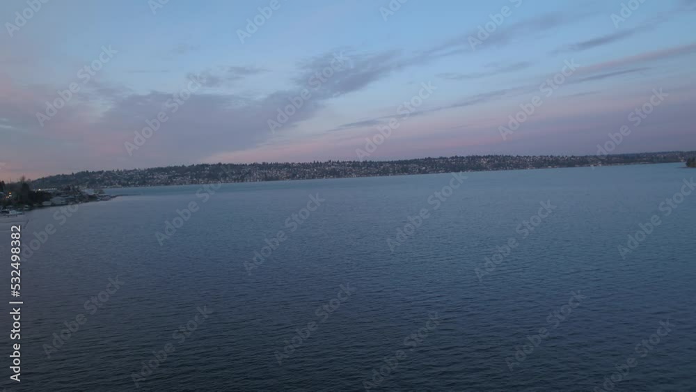 Wide aerial of Lake Washington in Seattle at sunrise with pink clouds Wide aerial of Lake Washington in Seattle at sunrise with pink clouds