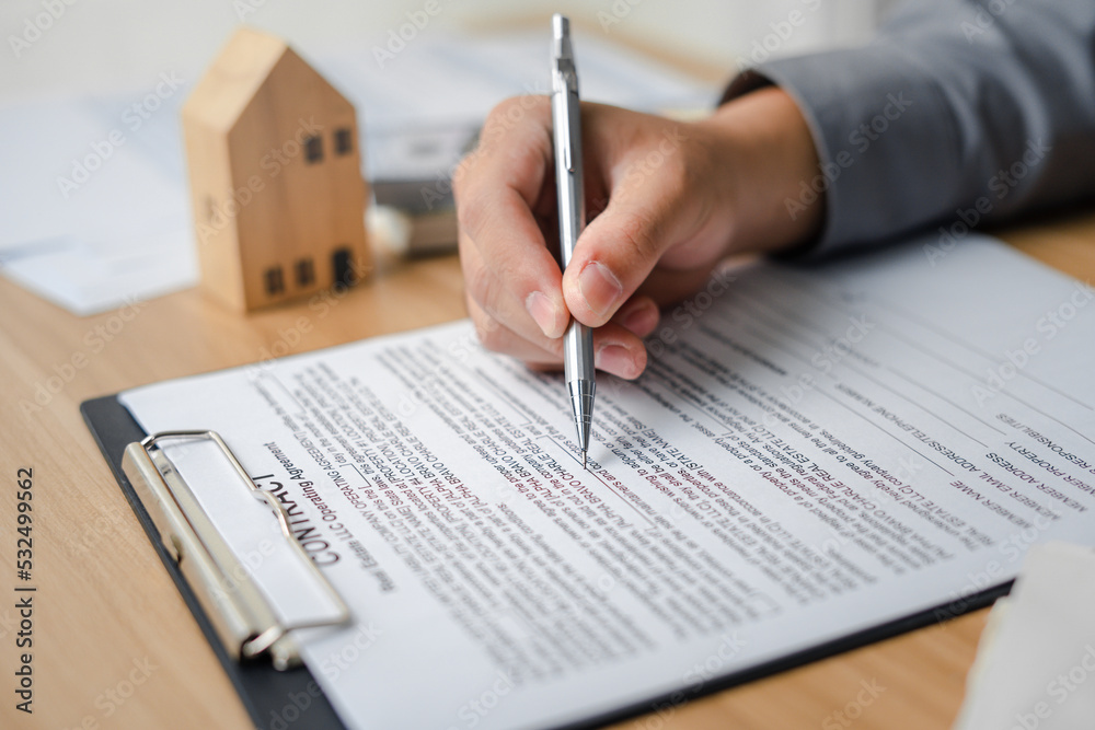 Clients sign real estate contracts through their brokerage agents to purchase a home a profitable investment for a safe residence with a promotion for a loan from a bank to buy property. Clients sign real estate contracts through their brokerage agents to purchase a home a profitable investment for a safe residence with a promotion for a loan from a bank to buy property.