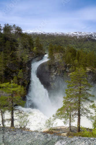 Kleivafossen or Colliding Waterfall, a beautiful waterfall in Norway with mountain views photo