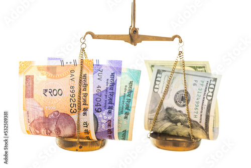 Obraz na płótnie exchange rate of the Indian rupee against the American dollar, financial concept, both currencies lying on a scale on a white background, w salonie