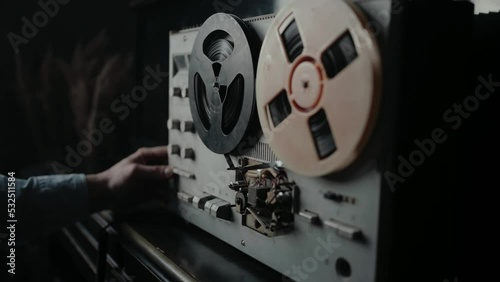 Wiretapping on the reel tape recorder in secret room. Special agent work. Spying conversations. Spy or intelligence gathering. Espionage concept.