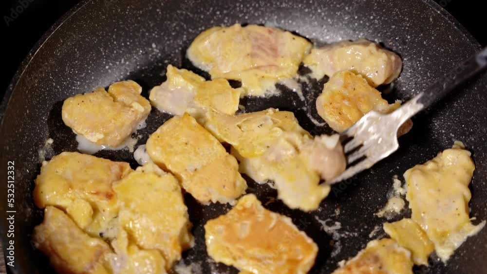 turn with a fork in a pan fry the pieces of white fish in the dough turn with a fork in a pan fry the pieces of white fish in the dough