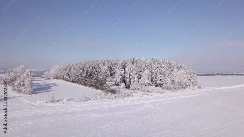 Slow flight in winter landscape with forest, winter holiday theme. Spruce tree covered by white snow Czech Republic, Vysocina region highland Slow flight in winter landscape with forest, winter holiday theme. Spruce tree covered by white snow Czech Republic, Vysocina region highland